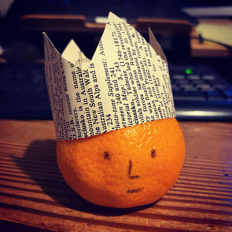 Clementine: drawn on face and a paper crown